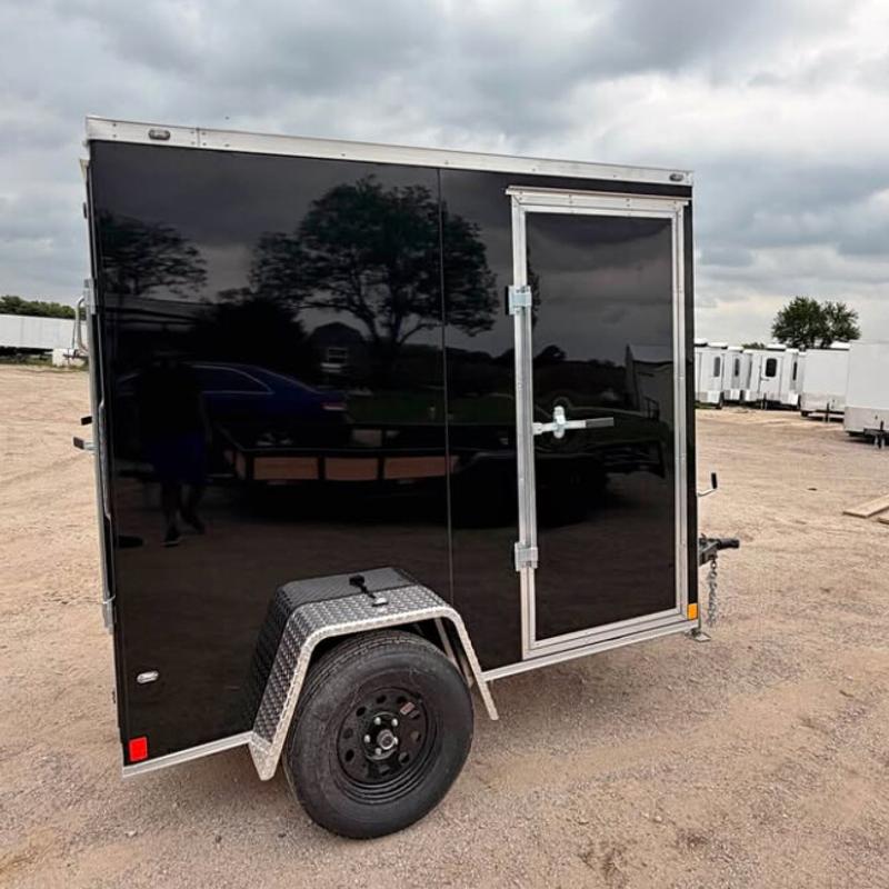 Black 5 by 8 single-axle enclosed cargo trailer with a side access door